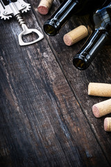 Bottle of wine,  corks and corkscrew