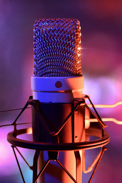 Close up studio condenser microphone and equipment live recordin