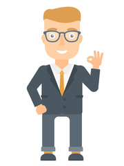 Smiling businessman showing ok sign.
