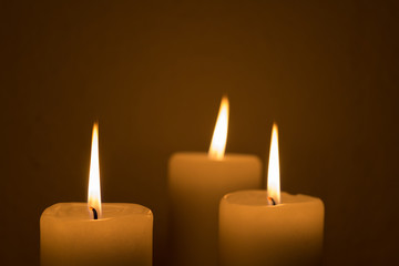 three burning candles