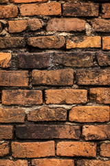 Historical old brick wall with moss and dust attached by its life time.