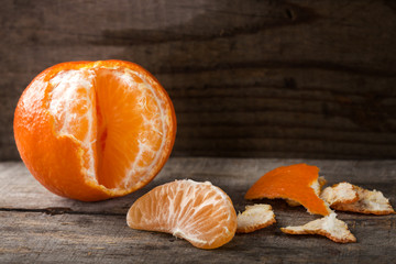 Fresh peeled tangerine and one slice