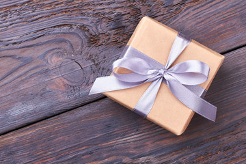 Wrapped gift box with bow. Ribbon on present box. Gift for the long memory.