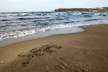 sea written on the beach near Mudanya in Bursa