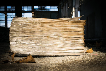 open old book in an abandoned factory