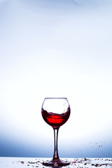 Wine splashing in glass