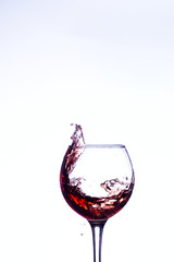 Wine splashing in glass