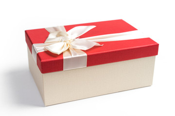 Red gift box with white ribbon isolated on white background. 