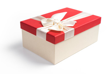 Red gift box with white ribbon isolated on white background. 