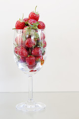 Strawberry berries in a glass of wine.