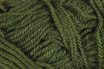 Natural green fine wool threads texture, textured clew yarn macro closeup horizontal background pattern 
