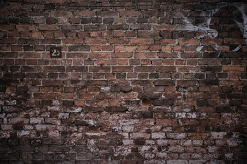 Old brick wall, old texture of red stone blocks closeup