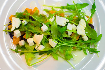 Fresh diet salad with arugula; pumpkin and beets. Delicious and
