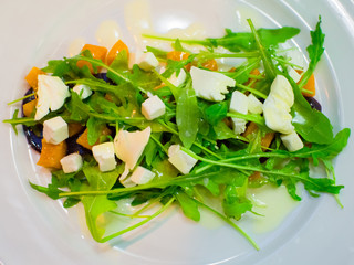 Fresh diet salad with arugula, pumpkin and beets. Delicious and
