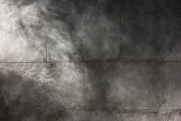 Obraz premium Shadow on indoors wall made with slabs of beton