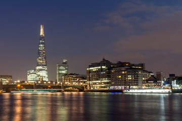 Naklejka na ściany i meble LONDON, ENGLAND - JUNE 17 2016: Night Panorama of Southwark Bridge, The Shard skyscraper and Thames River, London, United Kingdom