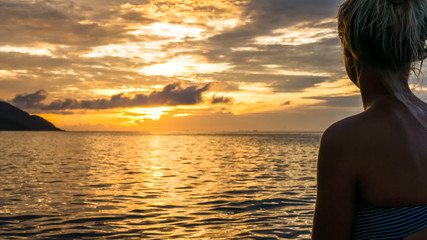 Silhouette of Jung Women in Warm Sunset Light, Kri Island. Raja Ampat, Indonesia, West Papua