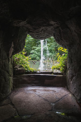 View from the cave to the waterfall and the abandoned pond
