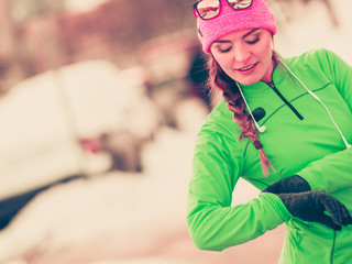 Woman fit sport model training outdoor on cold day