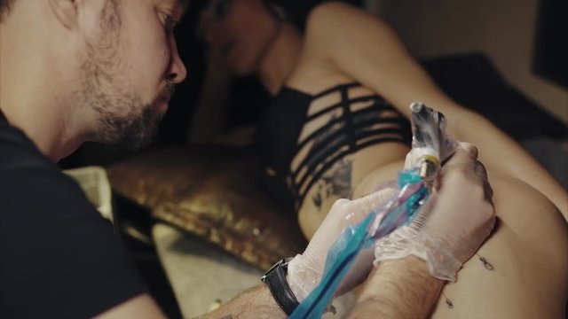 Tattoo artist make tattoo at the studio 4K