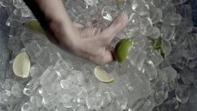 4k Shot of Cold Ice and Hand Grabbing Ice Cubes