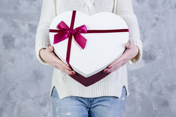 Valentines day gift heart box in hands