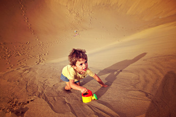 Handsome boy alone in the desert