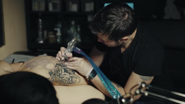 Tattoo artist make tattoo at the studio 4K