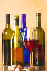 wine bottle and glass on a table