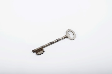 Old iron key on white background. Isolated.