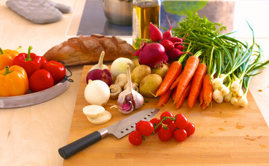 Young Woman Cooking in the kitchen. Healthy Food