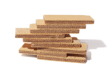 Pile of wafers with chocolate on white background