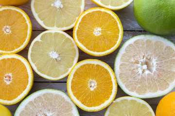 Fototapeta na wymiar slices of citrus fruit on wooden background