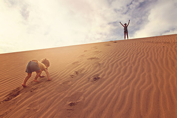 Mother with son in a desert in Gran Canaria