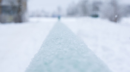 Green tube covered with beautiful snowflakes.