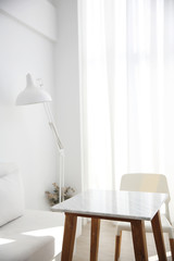table and chair with white lamp