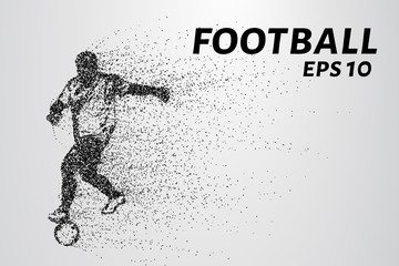 Fototapeta premium Football of the particles carries in the wind. Silhouette of a football player from circles.