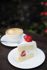 Strawberry cake on wood