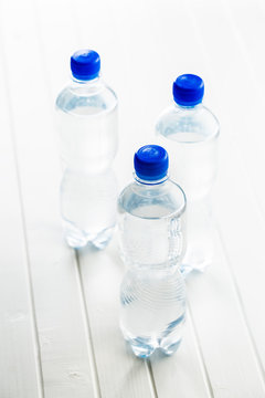 Small plastic water bottle.