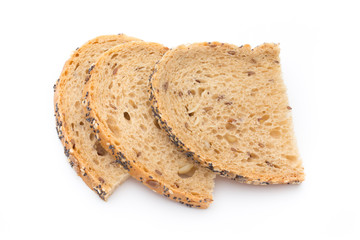 White bread sliced wholegrain bread on a wooden table.