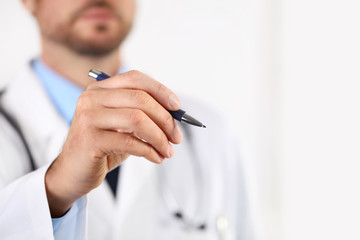 Doctor hand with a pen pointing on white