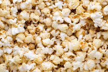Popcorn background. Caramel sweet corn. Cinema snack.