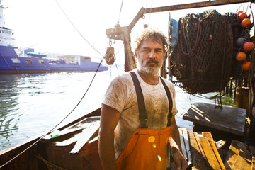 A fisherman in Maine working to off load his catch. Port of Portland, Maine.