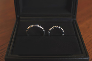 Engagement rings in wooden box.