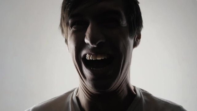 Evil man laughs. Dangerous mad genius
