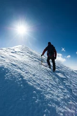Printed kitchen splashbacks Mountaineering Mountaineer reaches the summit of a snowy peak. Concept: courage, perseverance, strength. Swiss Alps, Zermatt, Europe.