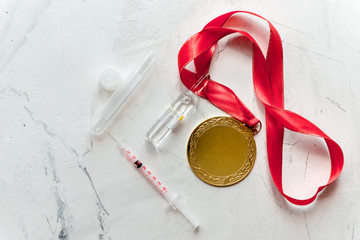Concept of doping in sport - deprivation medals top view