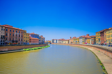 View of italian city by river Pisa, Italy. Photo about european vacation