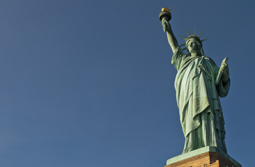 Horizontal shot of the Statue of Liberty, NYC, against a perfect clear and saturated blue sky