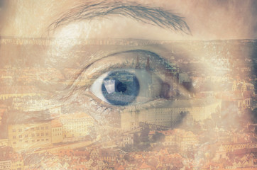 Double exposure image of an eye with city